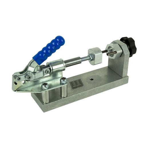Genuine Walbro carburettor service clamp tool, SKU 500-539, shown holding a small engine carburettor